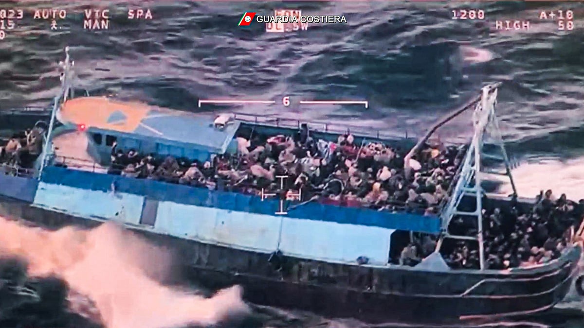 This photo grabbed from an aerial video made available by the Italian Coast Guards on 11 March 2023 shows a boat overloaded with migrants during a Coast Guards rescue operation on 10 March 2023 off the coast of Calabria, southern Italy.