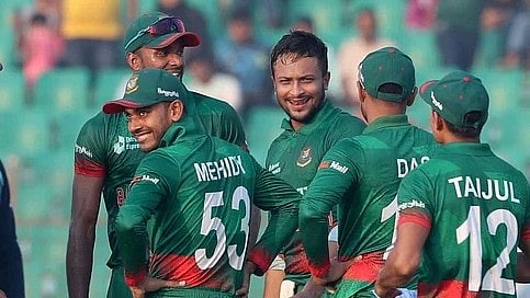 Shakib Al Hasan celebrates a wicket with teammates