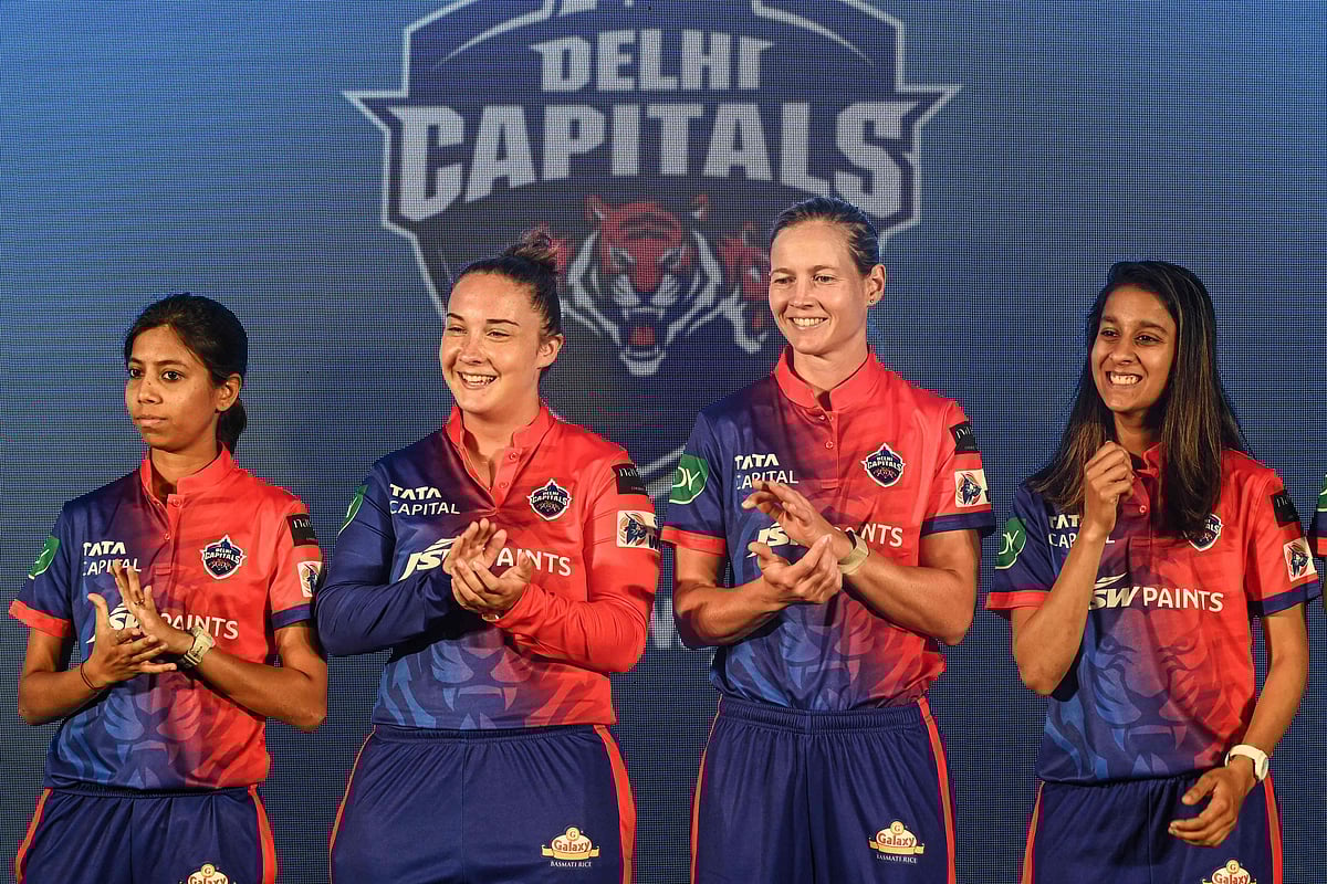 (L-R) Delhi Capitals cricketers Aparna Mondal, Alice Capsey, Meg Lanning and Jemimah Rodrigues applaud their teammates during a press conference ahead of the inaugural Women's Premier League (WPL), in Mumbai on 2 March 2023