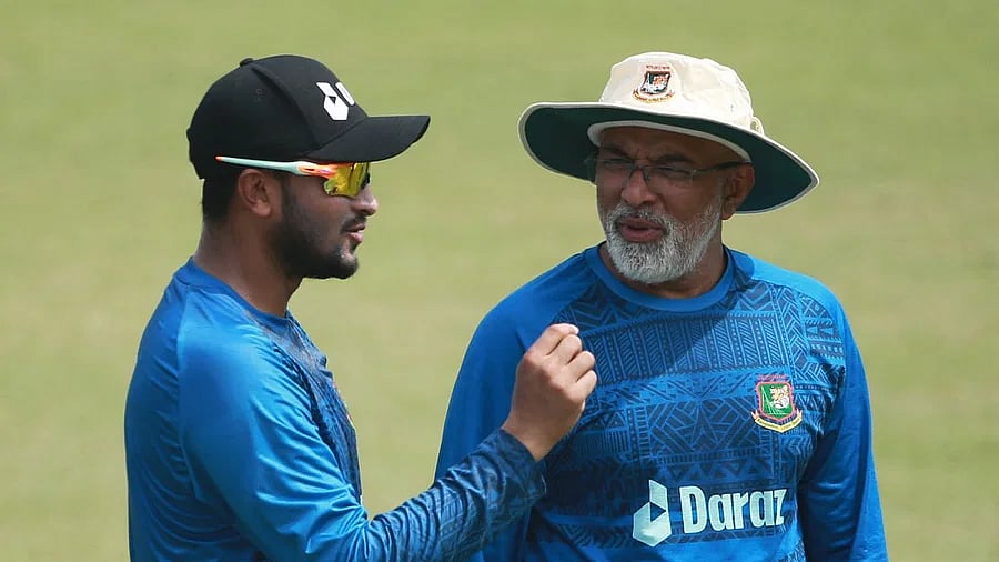 Coach Chandika Hathurusingha speaks with Test captain Shakib Al Hasan