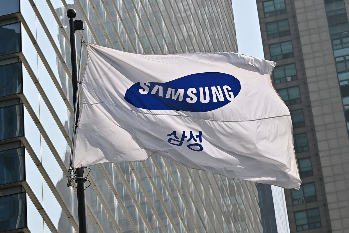 A Samsung flag flutters outside the company's Seocho building in Seoul on April 27, 2023. Samsung Electronics on April 27, reported its worst quarterly profits in 14 years, blaming slowing consumer spending on electronics and a global microchip glut that hit its core memory business.