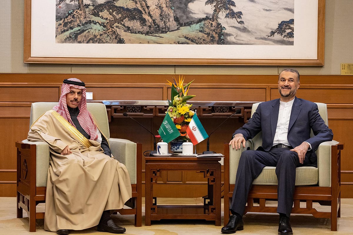 This handout picture released by the Saudi Press Agency shows Saudi Foreign Affairs Minister Prince Faisal bin Farhan (L) and Iran's Foreign Minister Hossein Amir-Abdollahian (R) during a meeting in Beijing on April 6, 2023