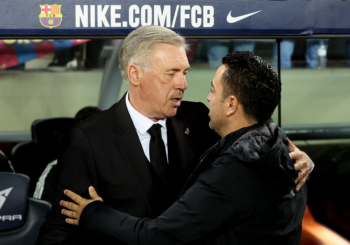 Real Madrid coach Carlo Ancelotti with FC Barcelona coach Xavi
