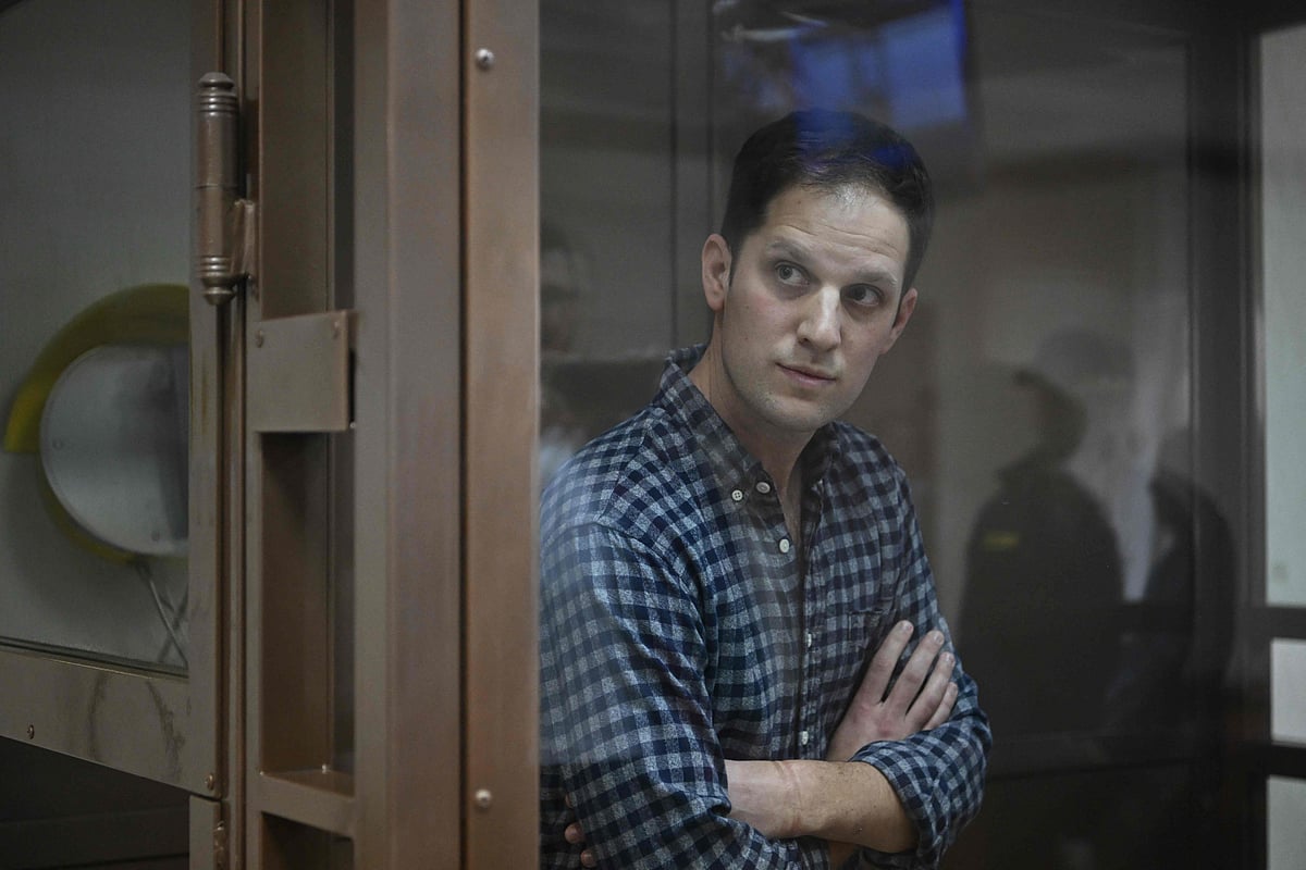 US journalist Evan Gershkovich, arrested on espionage charges, stands inside a defendants' cage before a hearing to consider an appeal on his arrest at the Moscow City Court in Moscow on April 18, 2023.