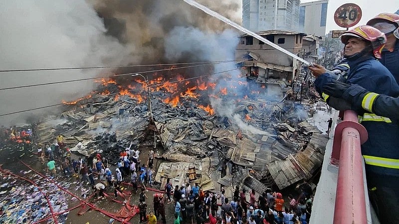 Fire service units working to douse the fire at Banga Bazar.