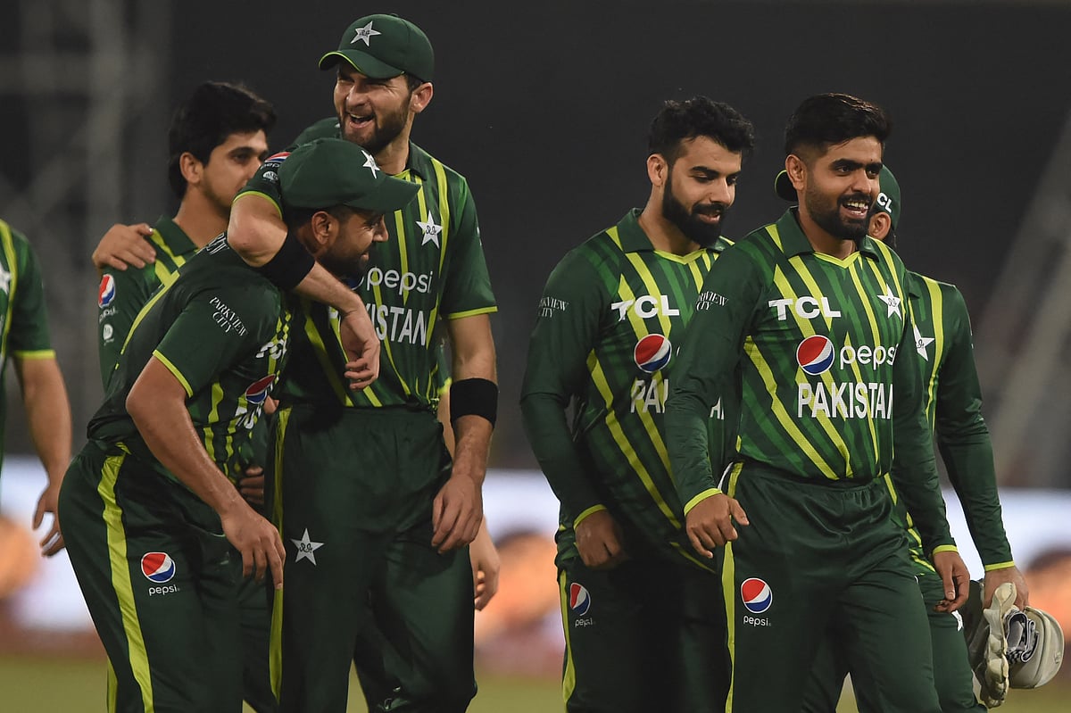 Pakistan's captain Babar Azam and teammates celebrate after winning the first Twenty20 against New Zealand at the Gaddafi Cricket Stadium in Lahore on 15 April 2023