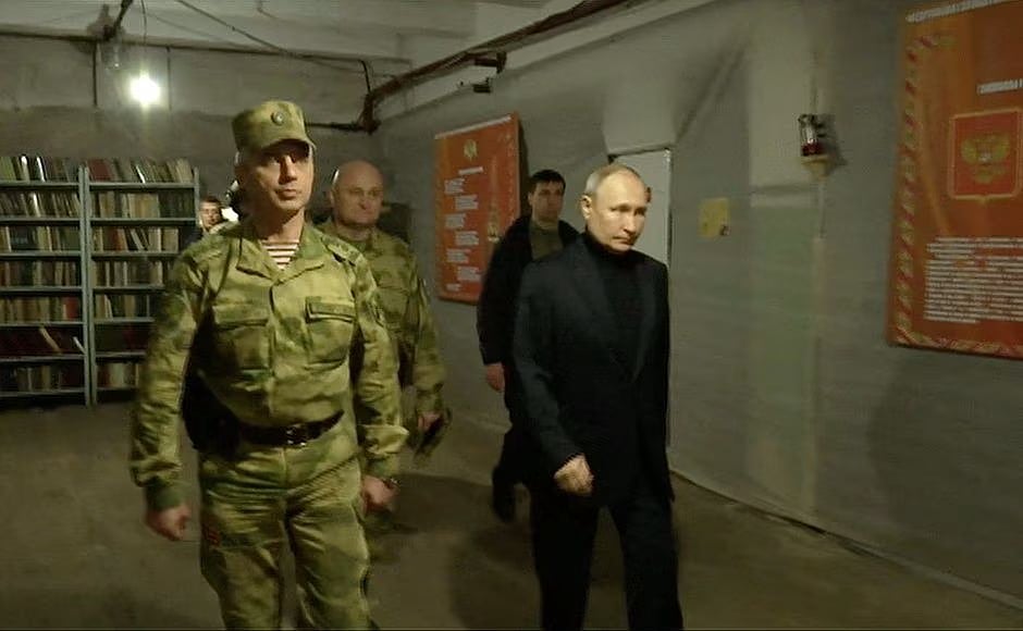 Russian president Vladimir Putin visits the national guard headquarters in the Luhansk Region, Russian-controlled Ukraine, in this still image taken from handout video released on 18 April, 2023.