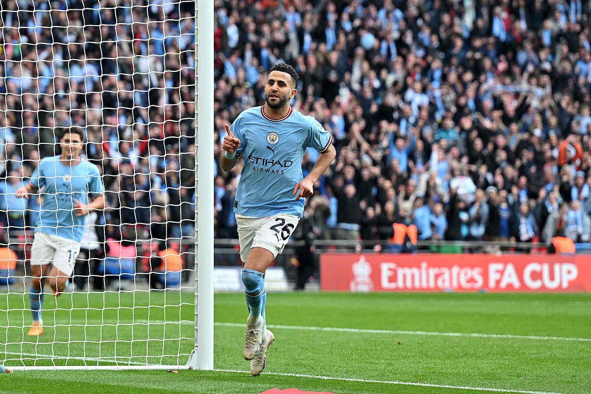 Manchester City's Algerian midfielder Riyad Mahrez celebrates scoring the team's second goal during the English FA Cup semi-final football match against Sheffield United at Wembley Stadium in north west London on 22 April, 2023