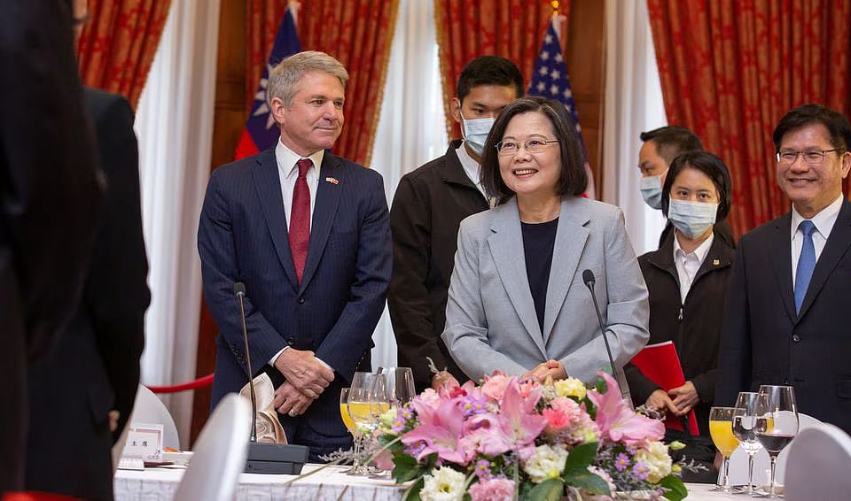 Taiwan President Tsai Ing-wen stands next to Michael McCaul, Chairman of the US House Foreign Affairs Committee, who is leading a delegation of US lawmakers visiting Taiwan, during a lunch meeting in Taipei, Taiwan, in this handout picture released on 8 April, 2023.