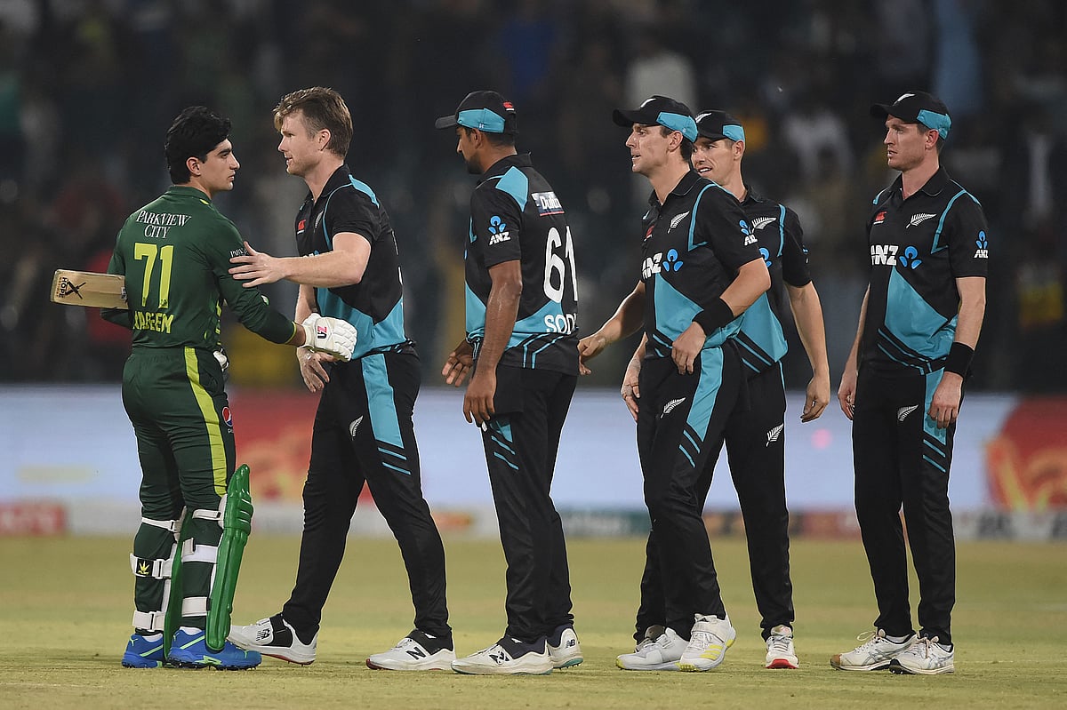 Pakistan's cricketer Naseem Shah shakes hands with New Zealand's players at the end of the 3rd T20I between Pakistan and New Zealand at the Gaddafi Cricket Stadium in Lahore on 18 April 2023