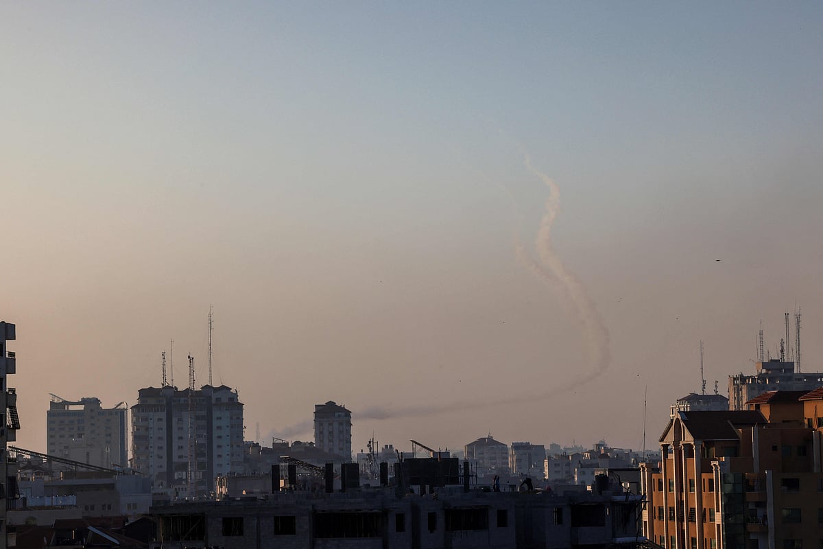 Trails of smoke are seen as rockets are fired from Gaza towards Israel, in Gaza City on May 2, 2023
