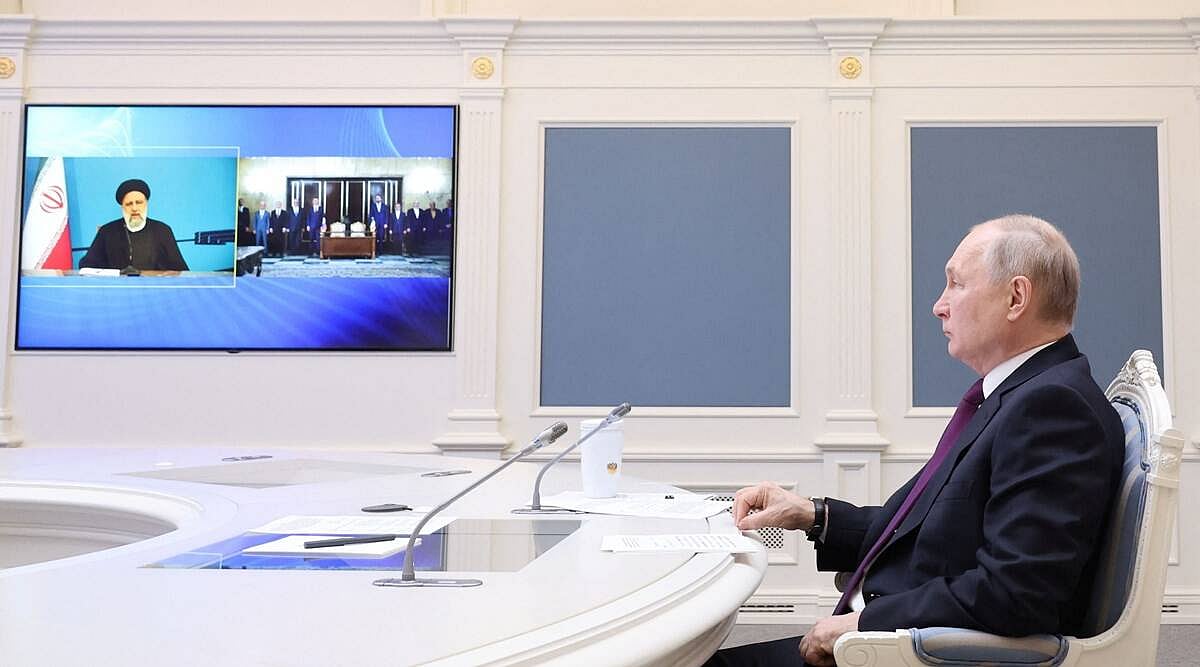 Russian president Vladimir Putin, together with Iranian president Ebrahim Raisi, takes part in the ceremony of signing an agreement on the construction of the Rasht-Astara railway, via video link at the Kremlin in Moscow, Russia.