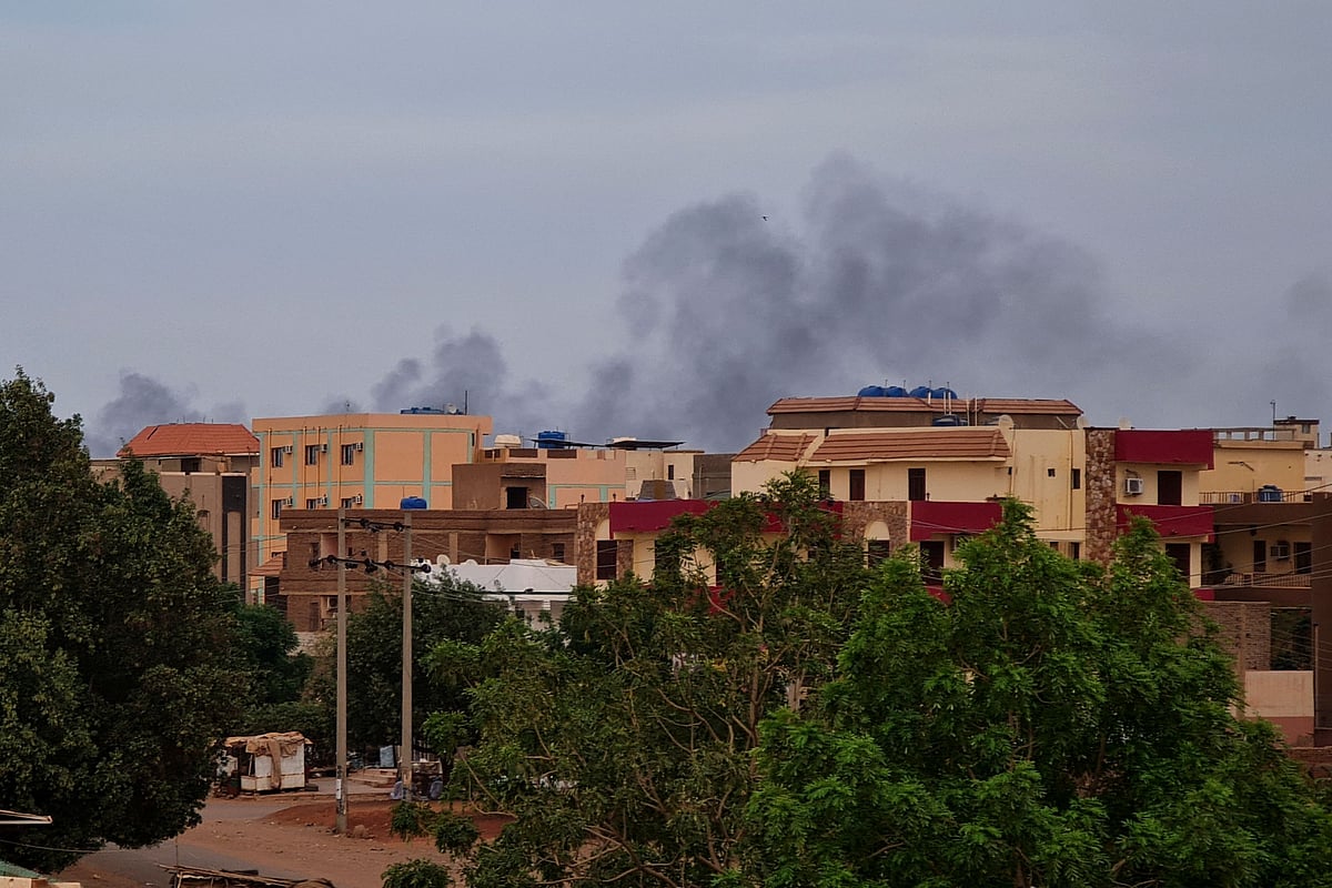 Smoke billows over residential buildings in Khartoum on 30 April, 2023 as deadly clashes between rival generals' forces have entered their third week. Heavy fighting again rocked Sudan's capital as tens of thousands have fled the bloody turmoil and a former prime minister warned of the "nightmare" risk of a descent into full-scale civil war.