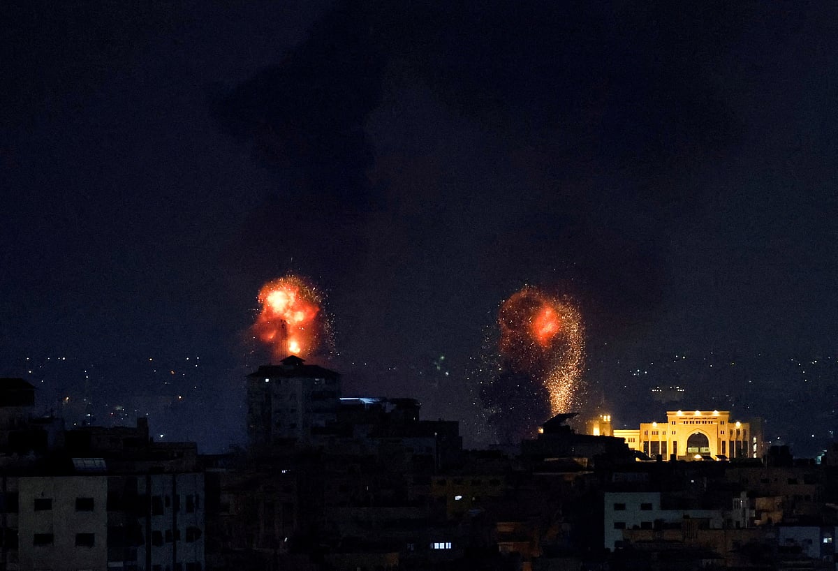 Explosions light up the sky after the Israeli military said in a statement that it has struck Islamic Jihad targets, in Gaza, 9 May, 2023.