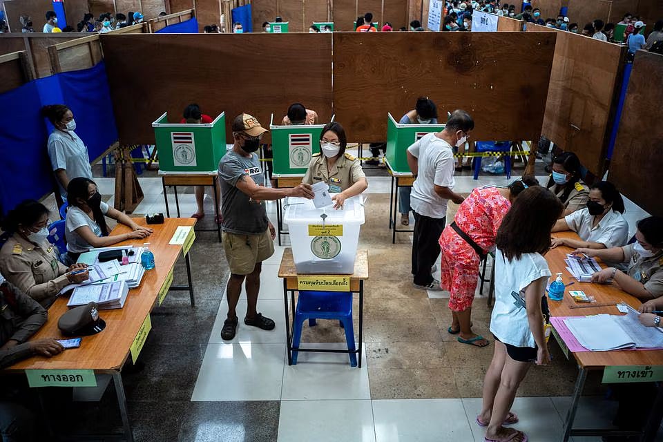 People cast their early vote for the upcoming Thailand's general election at a polling station in Bangkok, Thailand, on 7 May, 2023.