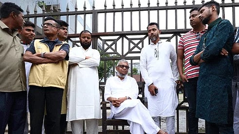 Police prevent setting up a stage for a rally earlier declared by mayor Ariful Haque Choudhury at Sylhet registrar ground. In protest, he sat in front of the gate. He said he would remain there until he gets permission for the rally. Later, police gave verbal permission. The photo was taken at 4:45pm on Friday.
