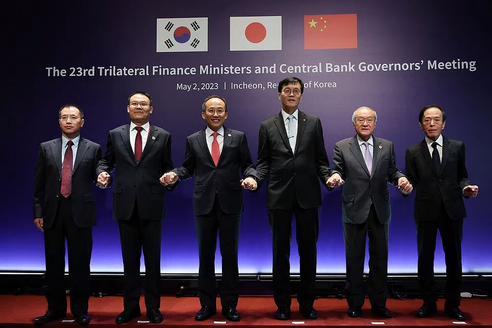 South Korean deputy prime minister and minister of economy and finance Choo Kyung-ho, Japanese finance minister Shunichi Suzuki, Wang Dongwei, a vice finance minister of China, governor of Bank of Japan Kazuo Ueda, deputy director general of People's Bank of China Chen Jing and governor of the Bank of Korea Rhee Chang-yong pose for a group photo during a photo session of the 23rd trilateral meeting of Finance Ministers of South Korea, Japan and China in Incheon, South Korea, on 2 May, 2023.