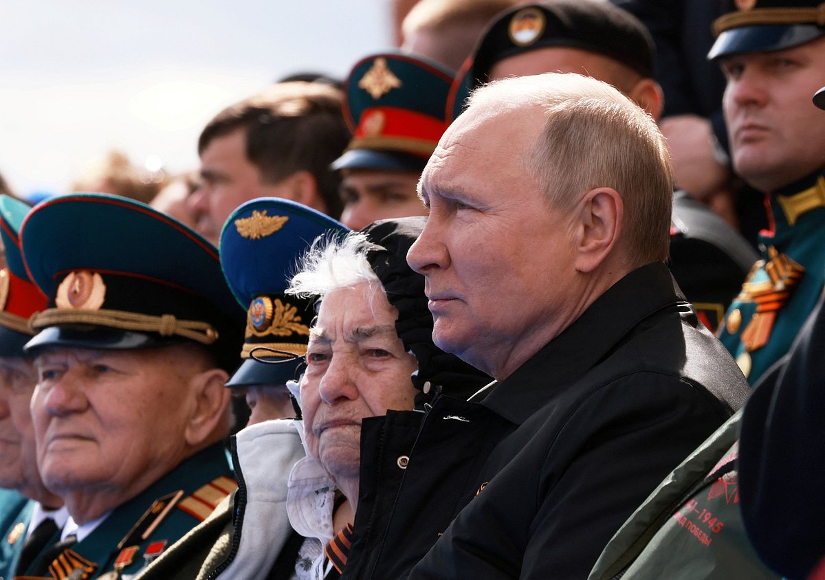 Russian President Vladimir Putin watches a military parade on Victory Day, which marks the 77th anniversary of the victory over Nazi Germany in World War Two, in Red Square in central Moscow, Russia May 9, 2022
