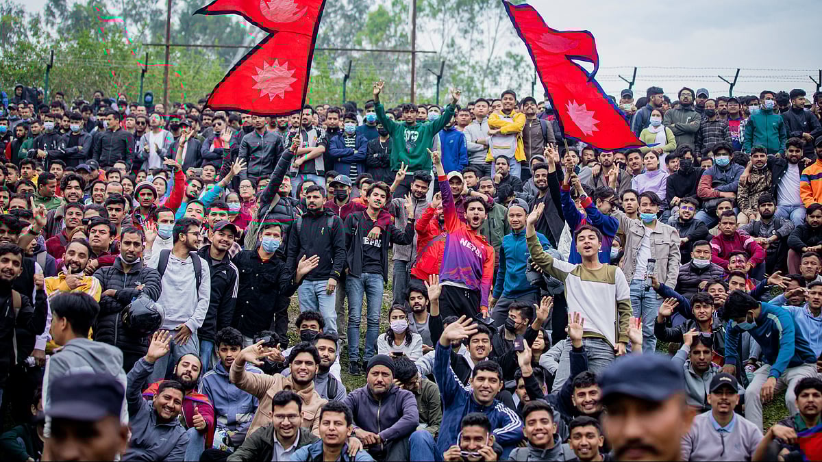 Nepal cricket team fans celebrate in the stands after their team qualified for the Asia Cup for the first time