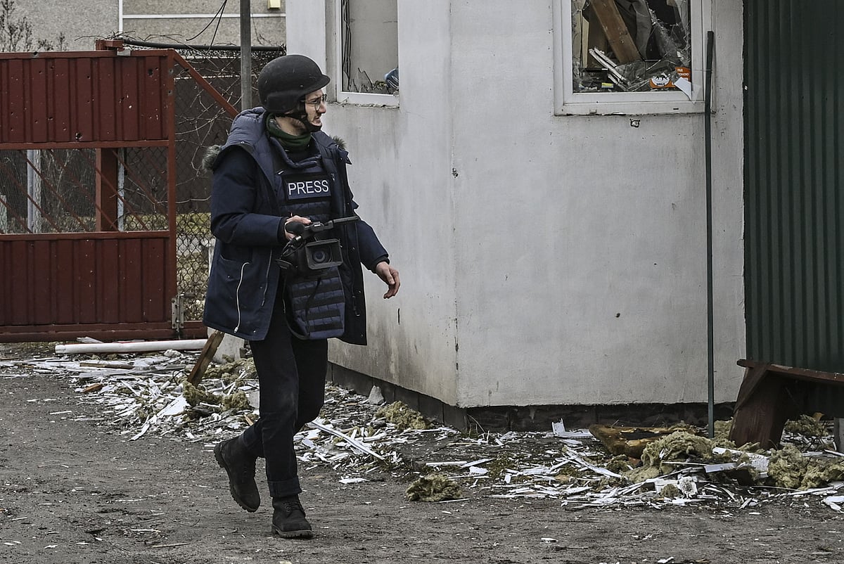 AFP journalist Arman Soldin, walks in a village after a shelling on March 3, 2022 in Ukraine. Arman was killed by a rocket strike as he reported with AFP colleagues from Ukrainian positions in Chasiv Yar on May 9, 2023