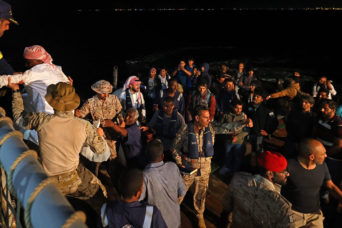 Saudi naval and special forces hoist evacuees aboard a vessel during a rescue operation from Port Sudan to Jeddah, on April 30, 2023