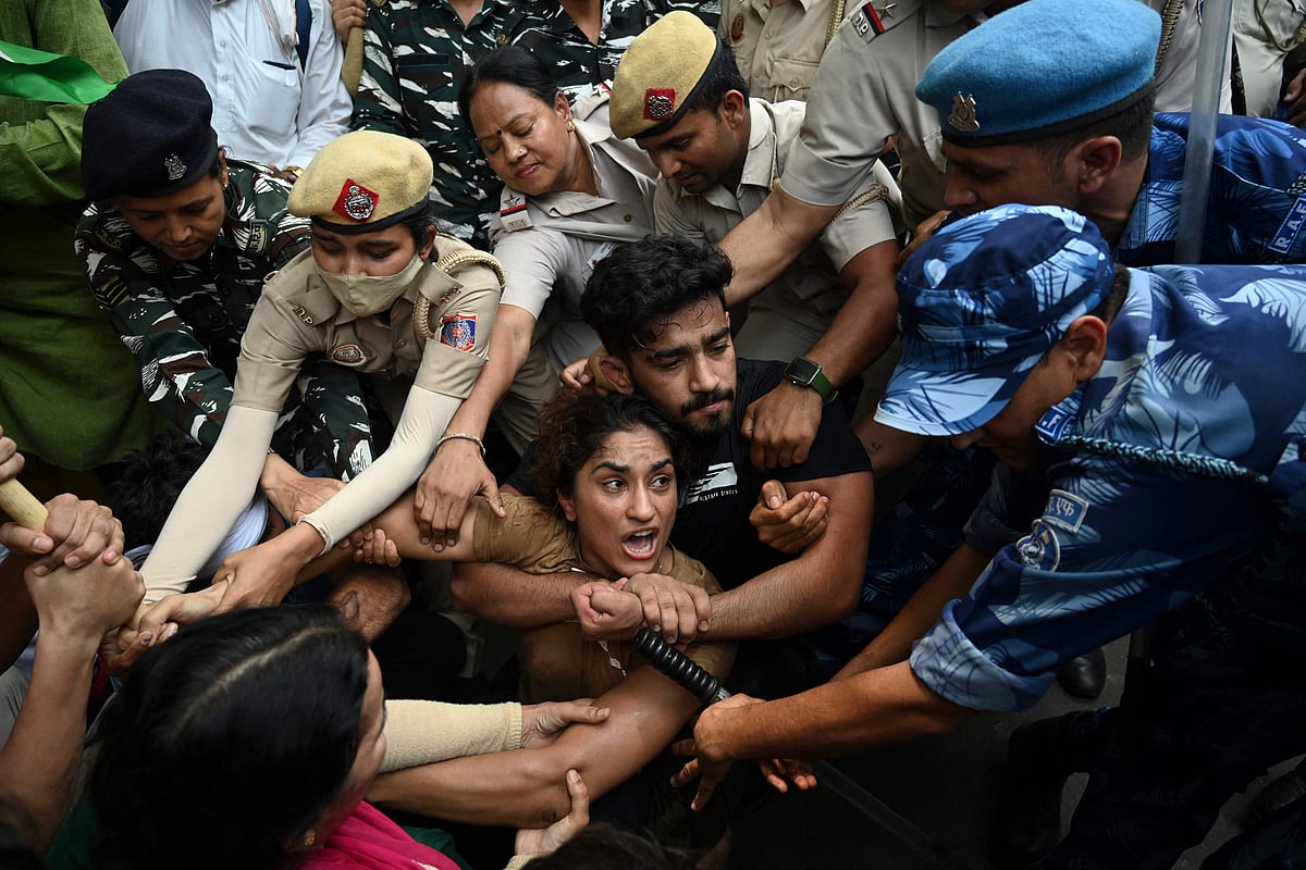 Indian wrestlers Vinesh Phogat with others are detained by the police while attempting to march to India's new parliament, just as it was being inaugurated by prime minister Narendra Modi, during a protest against Brij Bhushan Singh, the wrestling federation chief, over allegations of sexual harassment and intimidation, in New Delhi on 28 May 2023
