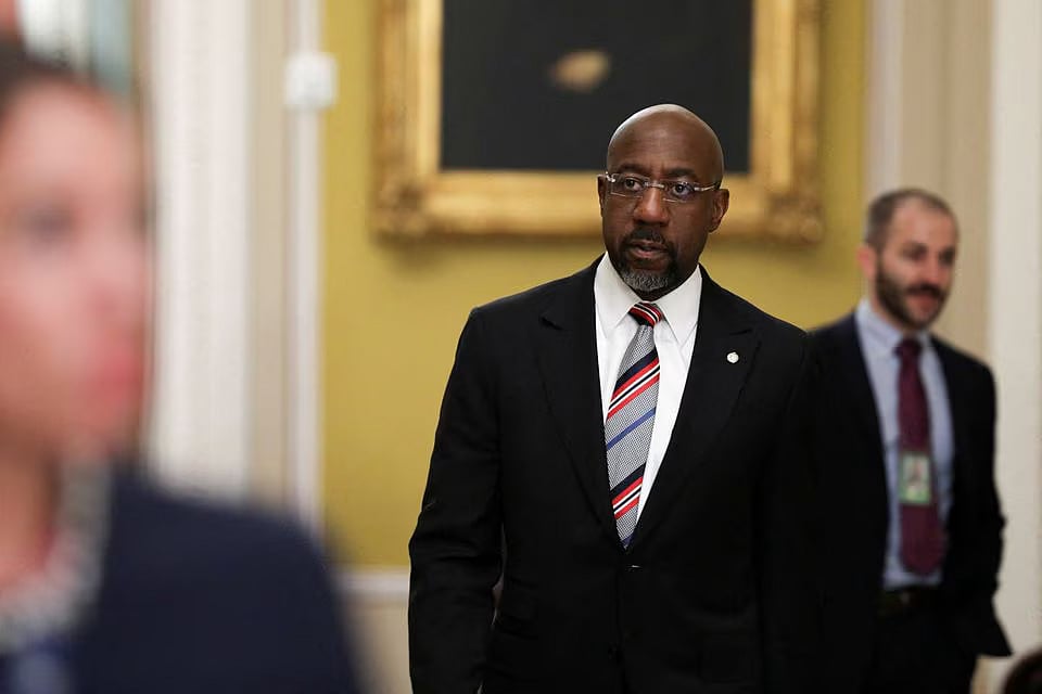 US Senator Raphael Warnock (D-GA) walks through the hall of the US Capitol in Washington, US, on 18 April, 2023.