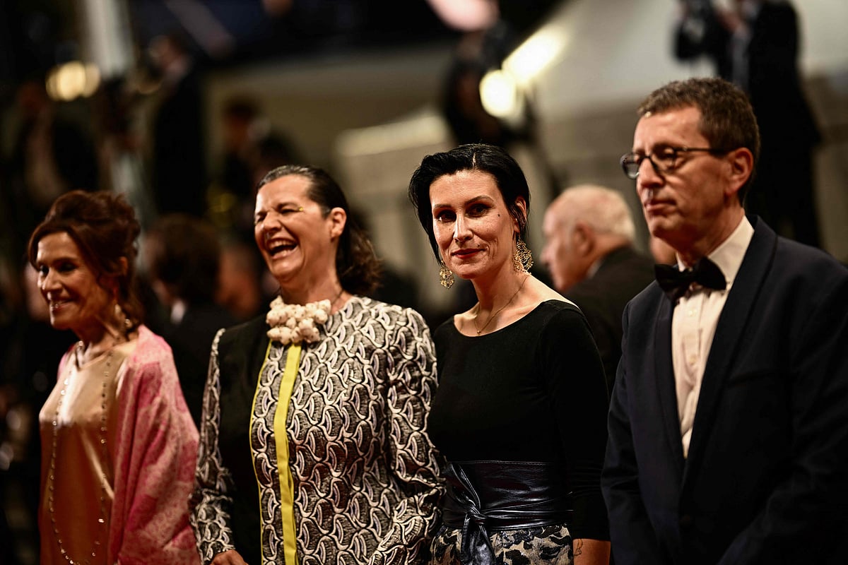 US filmmaker and president of the Oeil d'Or jury Kirsten Johnson (2ndL) arrives with jury members Canadian actress Sophie Faucher (L), French director Ovidie (2ndR) and French journaliste Jean-Claude Raspiengeas for the screening of the film "Les Filles D’Olfa" (Four Daughters) during the 76th edition of the Cannes Film Festival in Cannes, southern France, on May 19, 2023