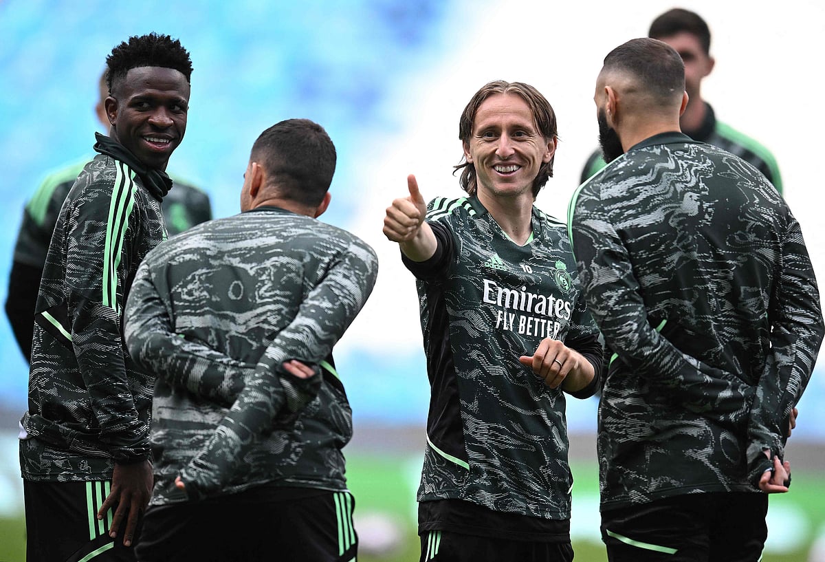 Real Madrid's Brazilian forward Vinicius Junior, Croatian midfielder Luka Modric and French forward Karim Benzema take part in a team training session at the Etihad Stadium in Manchester, England on 16 May 2023, on the eve of their UEFA Champions League semi-final second leg match against Manchester City