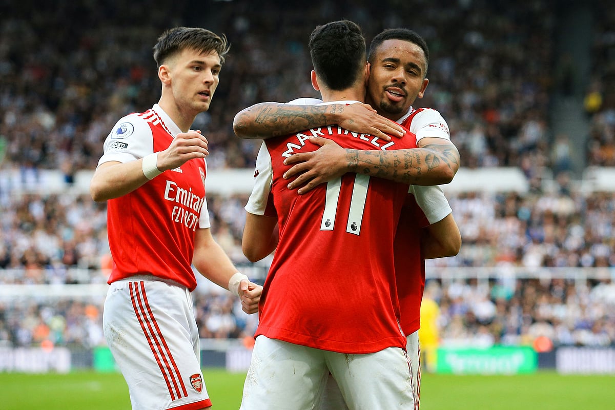 Arsenal's Brazilian midfielder Gabriel Martinelli (C) is congratulated by Arsenal's Brazilian striker Gabriel Jesus (R) after celebrates scoring his team's second goal during the English Premier League football match between Newcastle United and Arsenal at St James' Park in Newcastle-upon-Tyne, north east England on May 7, 2023