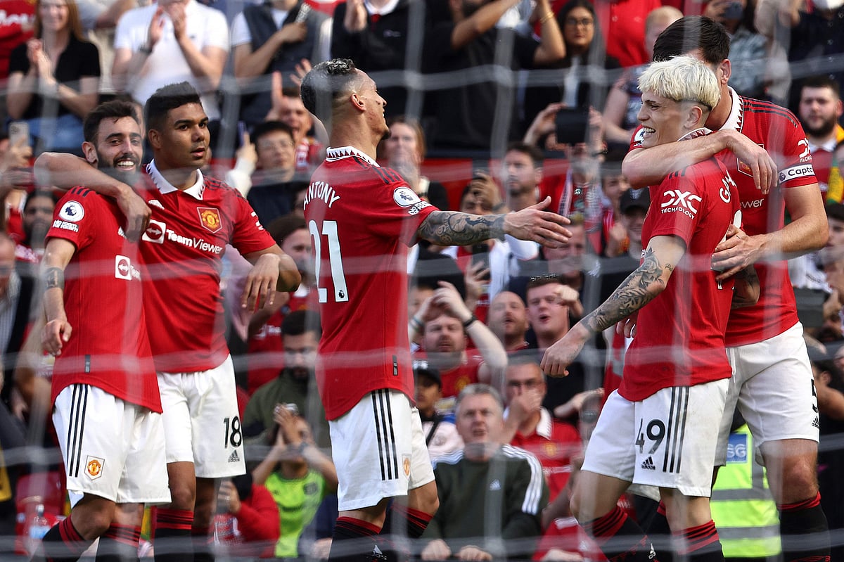 Manchester United's Argentinian midfielder Alejandro Garnacho celebrates with teammates after scoring his team's second goal during the English Premier League match between Manchester United and Wolverhampton Wanderers at Old Trafford in Manchester, north west England, on 13 May 2023
