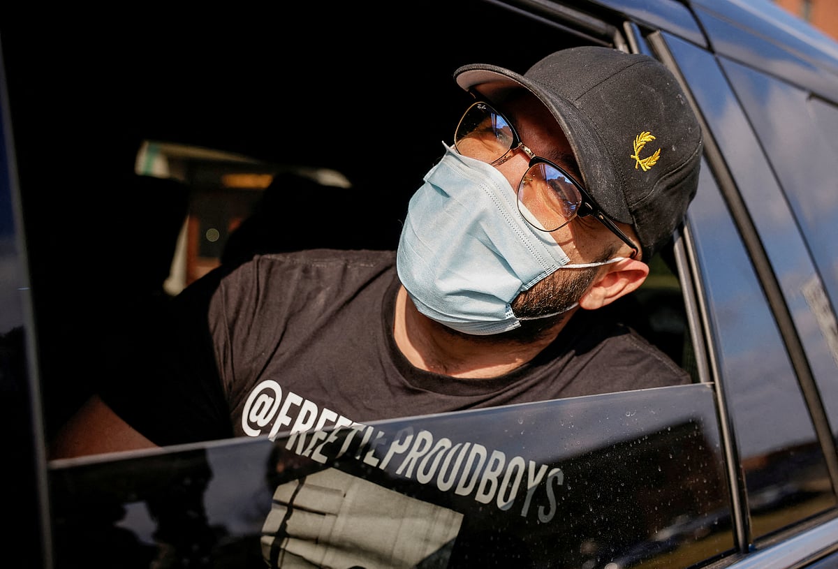 Proud Boys leader Enrique Tarrio looks towards the sky as he leaves the DC Central Detention Facility where he had been held since September 2021, in Washington, US, 14 January, 2022.