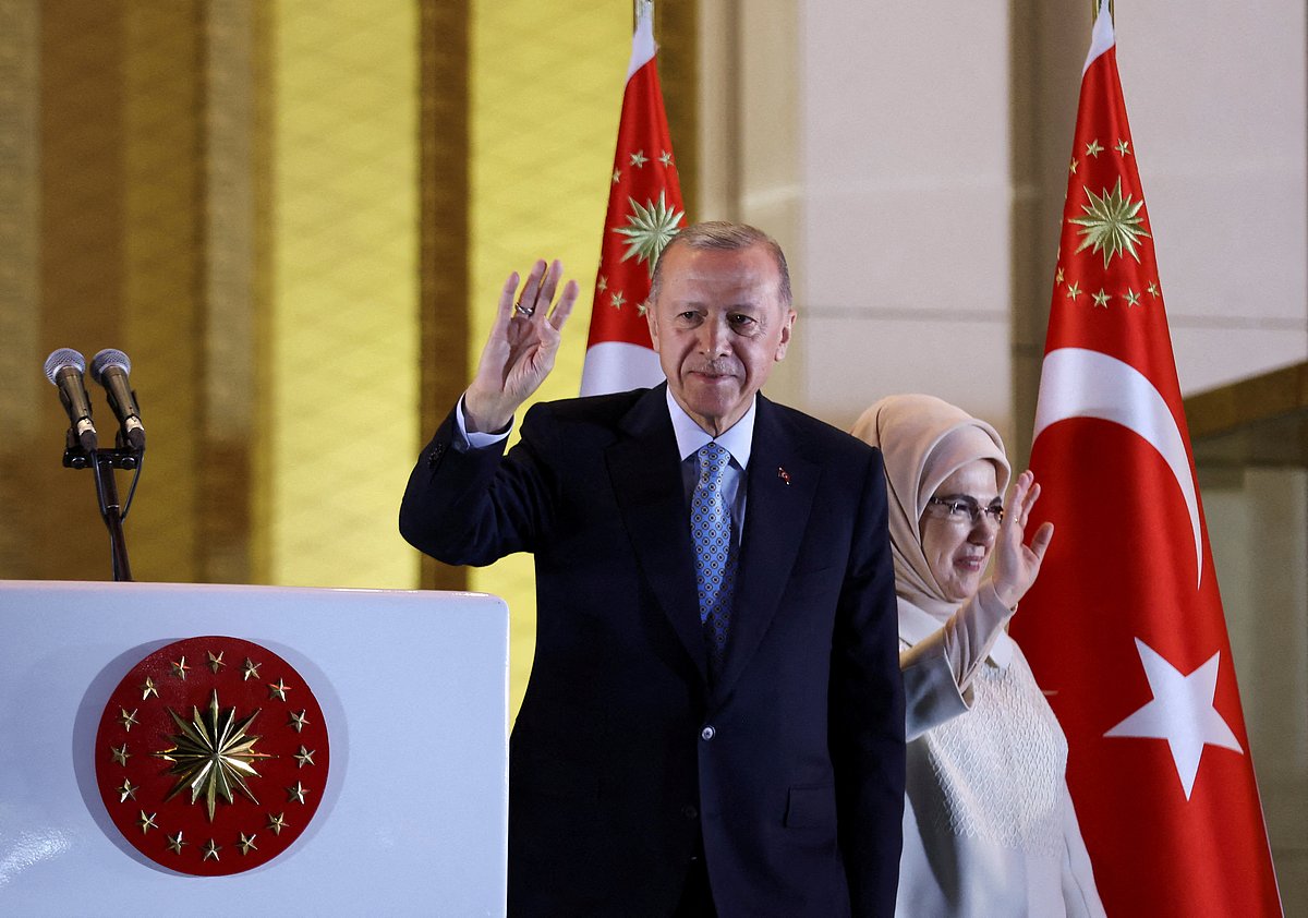 Turkish President Tayyip Erdogan and his wife Ermine Erdogan wave as he addresses his supporters following his victory in the second round of the presidential election at the Presidential Palace in Ankara, Turkey 28 May, 2023