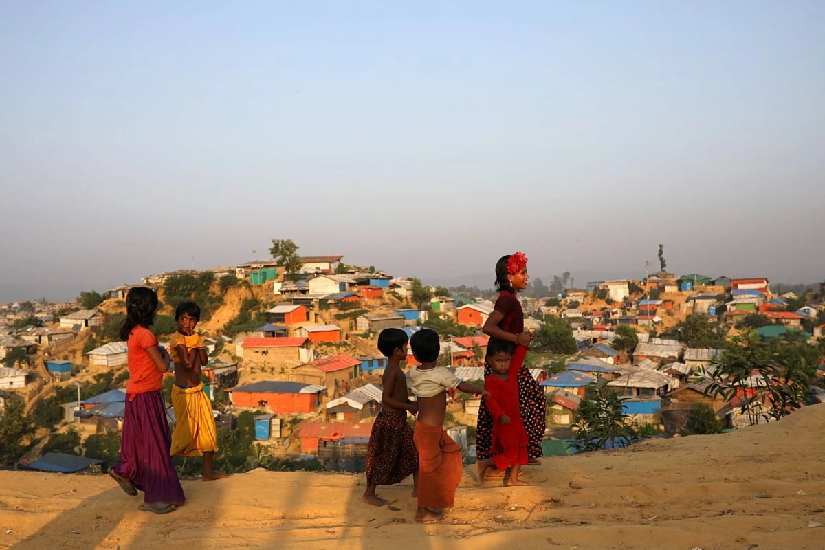 Rohingya refugee children walk along the road at Balukhali camp in Cox’s Bazar, Bangladesh, 16 November 2018.