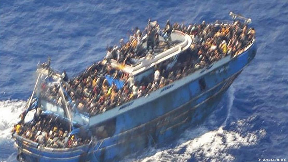 The Greek coast guard took this grainy photo of the overloaded fishing boat before it capsized