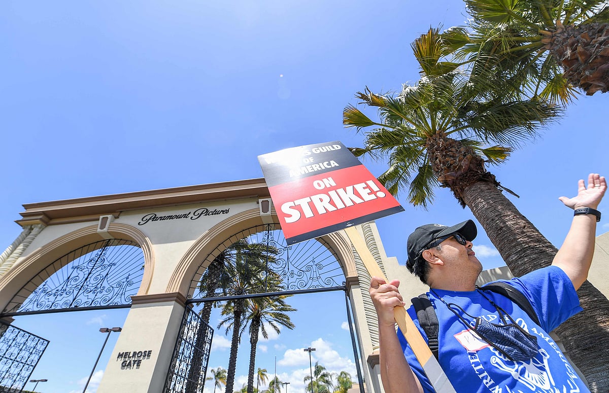 A demonstrator holds a sign in front of Paramount Studios during a screenwriter's strike in Los Angeles, California, on 2nd May, 2023.