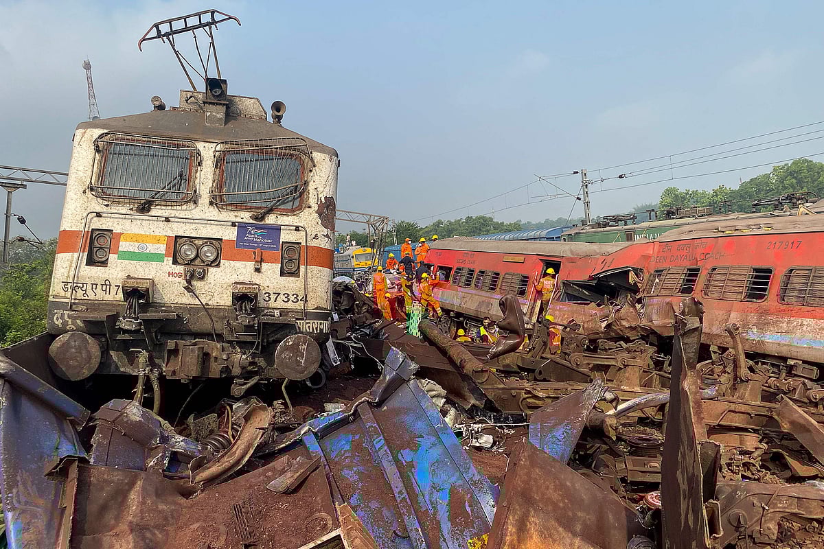 Damaged carriages are seen at the accident site of a three-train collision near Balasore, about 200 km (125 miles) from the state capital Bhubaneswar, on 3 June, 2023. At least 207 people were killed, more than 850 more were injured and many others are feared trapped after a horrific three-train collision late 2 June in eastern India's Odisha state, local officials said.