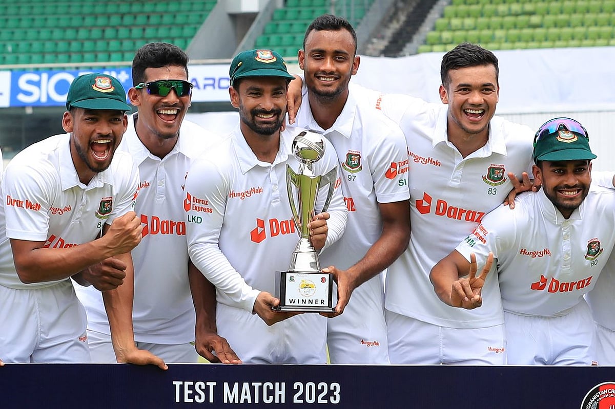 Players of Bangladesh team pose with trophy after beating Afghanistan on 17 June