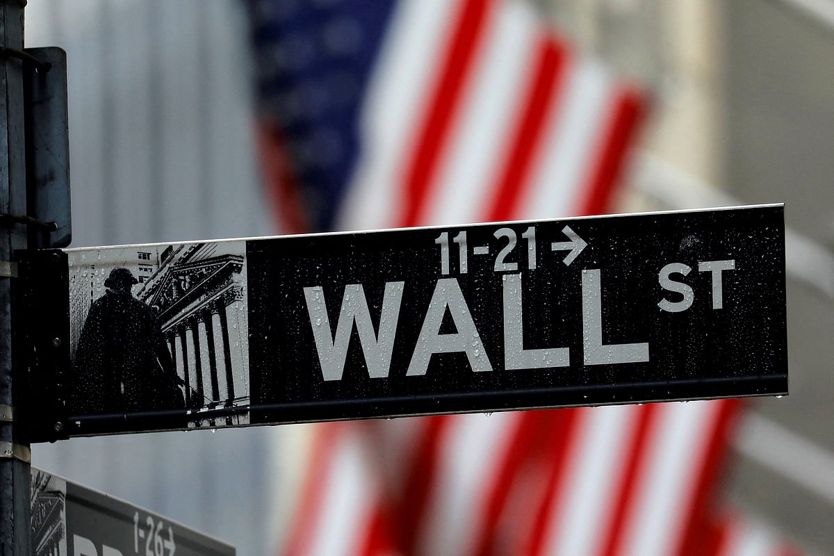 Raindrops hang on a sign for Wall Street outside the New York Stock Exchange in Manhattan in New York City, New York, U.S., October 26, 2020