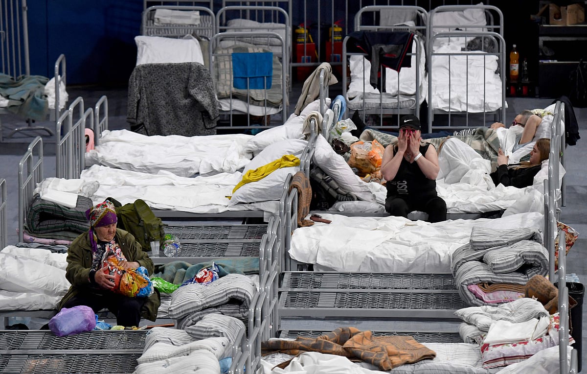 Residents evacuated from the Belgorod region's zones bordering Ukraine, including those from the town of Shebekino, are seen settled in a temporary shelter set up at the Belgorod Arena in the regional capital of Belgorod on 2 June, 2023