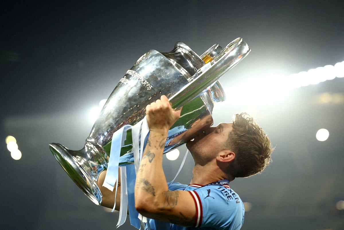 Manchester City's John Stones celebrates with the trophy after winning the Champions League