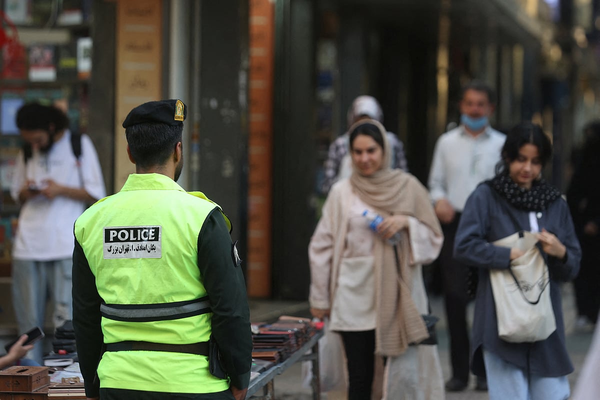 An Iranian police force stands on a street during the revival of morality police in Tehran, Iran, 16 July, 2023.