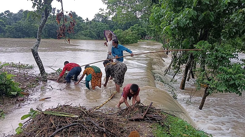 Flash flood water enters haor in Tilagaon, Doarabazar, Sylhet on 2 July, 2023