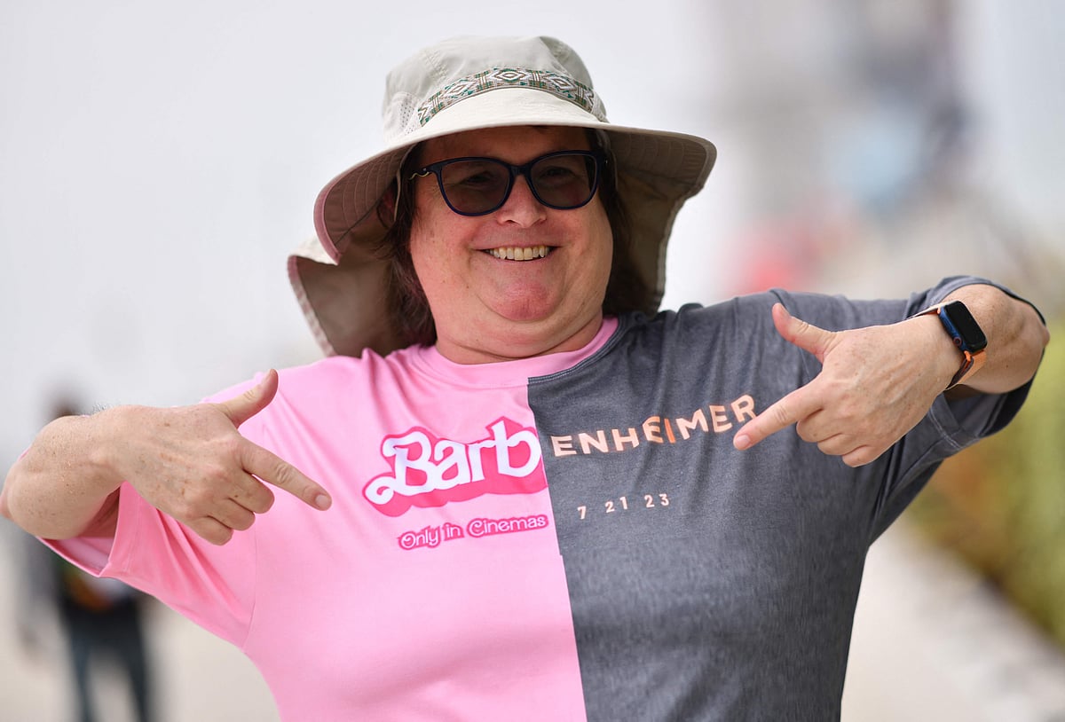 An attendee points at her Barbenheimer shirt outside the convention center during San Diego Comic-Con International in San Diego, California, on 20 July, 2023.