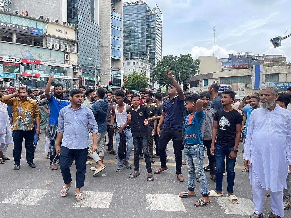 Traders chant slogans protesting against the closure of Gulshan Shopping Centre on 13 July 2023.