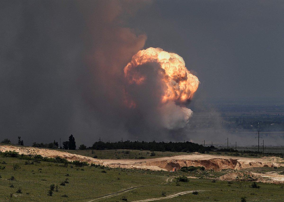 A picture shows detonation of ammunition caused by a fire at a military training field in the Kirovsky district of Crimea on 19 July, 2023