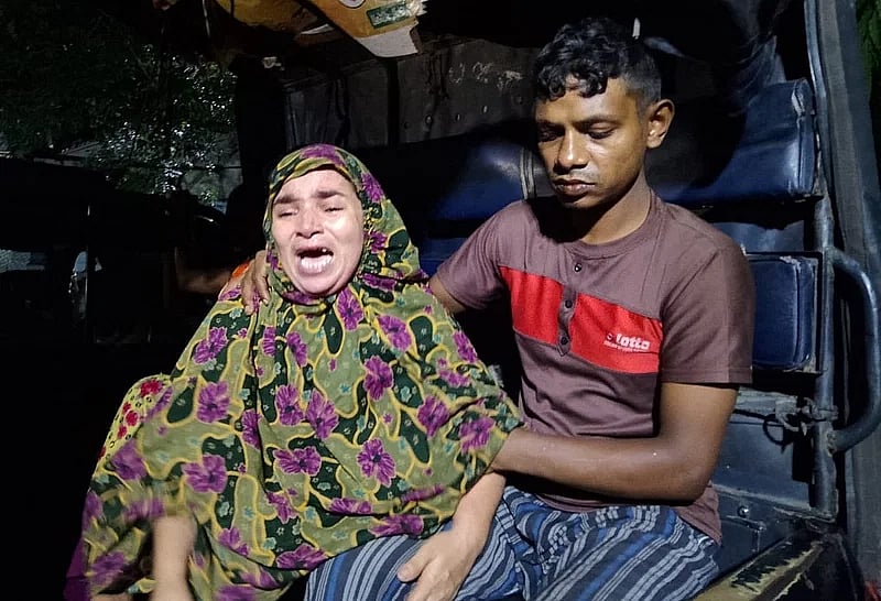 Mother of the child, ran over by bus, Parvin Akhter wails to mourn his son.
