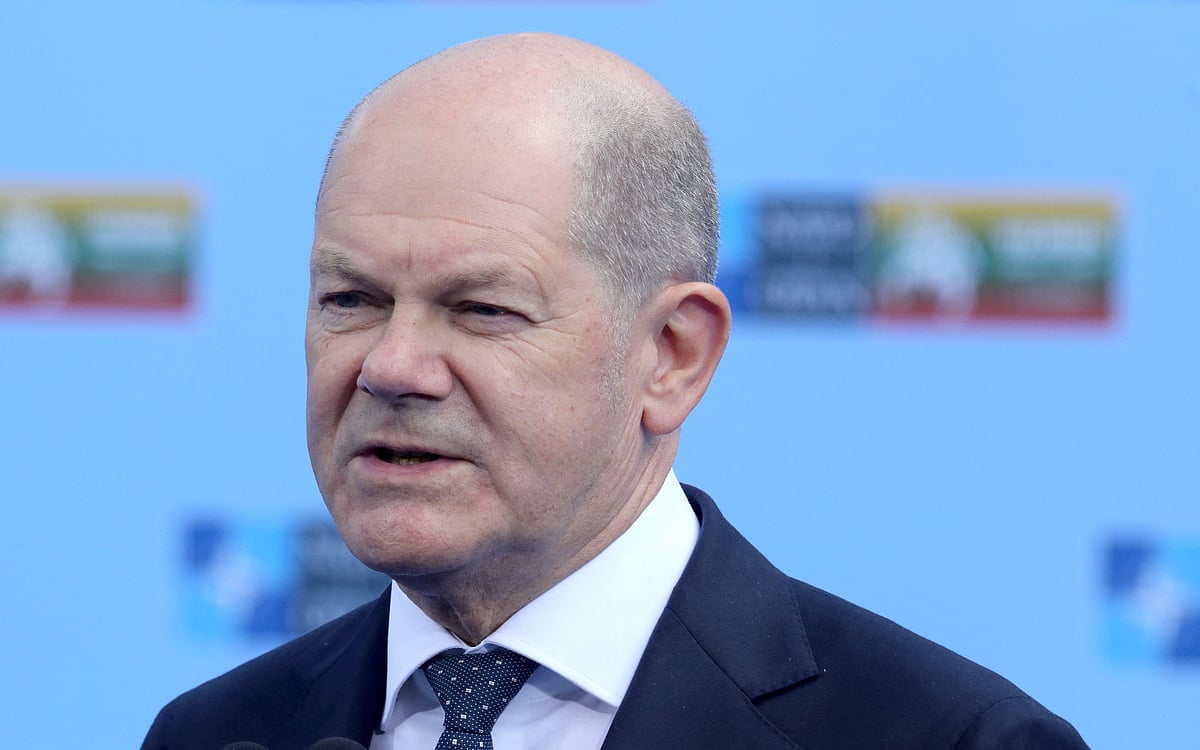 German Chancellor Olaf Scholz speaks as he arrives to attend the NATO Summit in Vilnius, Lithuania, on 11 July, 2023.