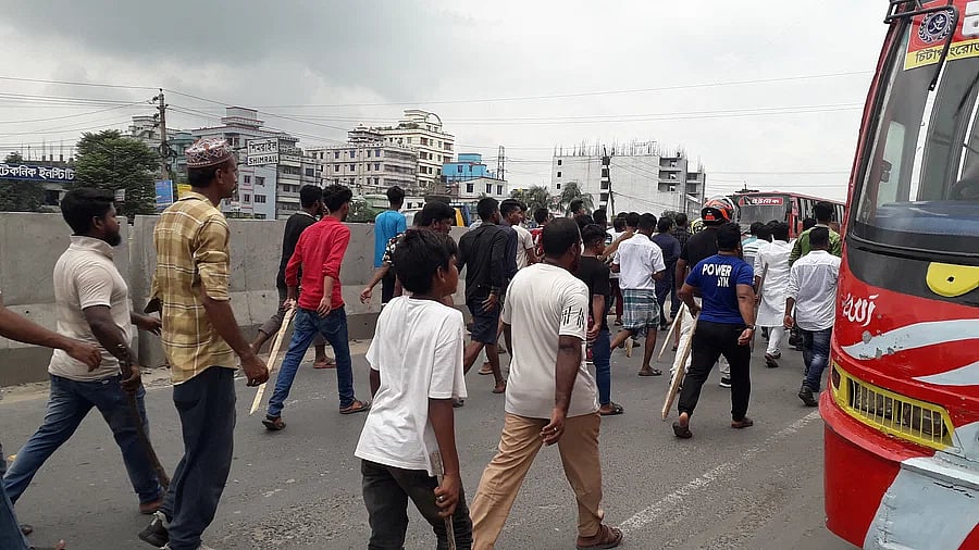 Awami League leaders and activists with sticks brought a procession at the signboard area of Shidhirgan on Dhaka-Chattogram highway at around 11:45am on Saturday.
