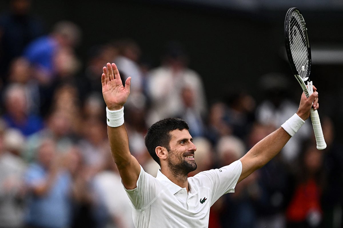 Serbia's Novak Djokovic celebrates winning against Italy's Jannik Sinner during their men's singles semi-finals tennis match on the twelfth day of the 2023 Wimbledon Championships at The All England Lawn Tennis Club in Wimbledon, southwest London, on 14 July, 2023